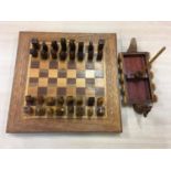 A modern Viking style chess set with Viking boat storage tray.