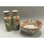 An Oriental bowl together with a pair of vases.
