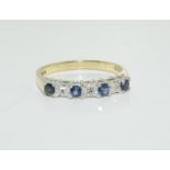 A 9ct gold Ladies Diamond and Sapphire 1/2 eternity ring, Size N.