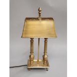 A modern contemporary brass effect twin columned table lamp.