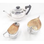 Silver teapot, milk jug and sugar bowl with gilded interior - Sheffield 1904 together with a
