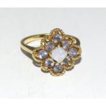 An amethyst/opal 9ct gold ring.