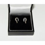 A pair of ladies 14ct gold diamond and Sapphire earrings.