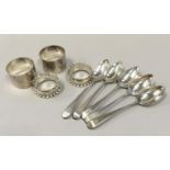 Collection of silver to include spoons and napkin rings.