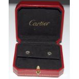 A pair of Cartier genuine 18ct white gold earring studs.