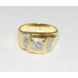 A Gents diamond solitaire 0.75 points with diamond shoulders set in 8.6g 14ct gold ring, Size N.