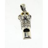 Silver monkey shaped whistle of pendant form.