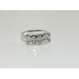 An 18ct white gold ten stone diamond ring, size Q.