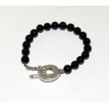 A genuine Tiffany silver and onyx bracelet (currently on their website).