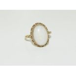 A 9ct gold ladies antique opal ring, Size N.