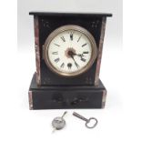Slate mantle clock with key.