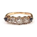 Three diamonds, approx 0.50ct and two sapphires set in 18ct gold ring. Size O.