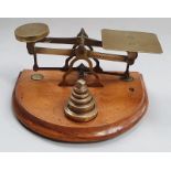 Vintage brass postal scales and weights.