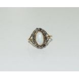 An antique opal and rose cut diamond gold ring, Size M.