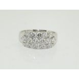 18ct white gold Diamond ring, set with 18 brilliant cut stones - 1.5cts approx. Size P.