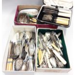 A box of silver plated flatware.