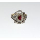 A Diamond old cut with centre Ruby 18ct gold ring.