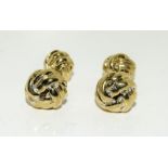 Pair of gold plated knot cufflinks.