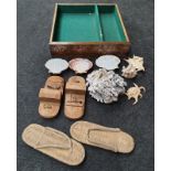 Coral and shell samples in tray with two pairs of oriental shoes.