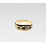 An 18ct gold antique diamond and sapphire ring.