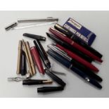 Collection of fountain pens, some with gold nibs, plus a vintage Zeal medical thermometer.
