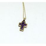 9ct yellow gold Amethyst pendant necklace in the form of a crucifix on gold chain.
