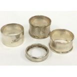 Four silver serviette rings.