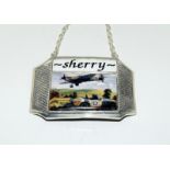 Silver plated bottle label 'Sherry' with ceramic image of a spitfire.