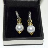 Pair of silver and pearl earrings.
