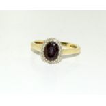 A 9ct gold ladies garnet cluster ring, size S (sold on behalf of the RNLI).