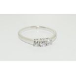 18ct white gold trilogy diamond ring, size L.