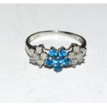 A ladies Diamond daisy ring set in 9ct white gold, Size N.