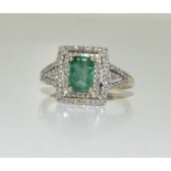 A ladies 14ct gold emerald and diamond Deco style ring. Size N.