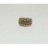 A 9ct gold keeper ring.