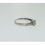 A 9ct white gold four stone diamond ring. Size J.