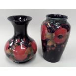 Two Moorcroft pomegranate vases, 20 and 21cm high.