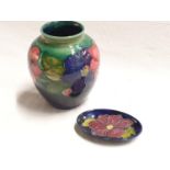 Moorcroft green gourd vase with pink and purple anemone.