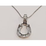 Silver H/M diamond horseshoe pendant.