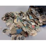 Tub of French stamps.