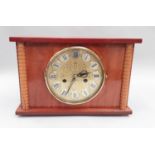 Period 8-day chiming 12 jewel mantle clock with key.