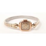 A Majex 9ct gold ladies watch in working order.