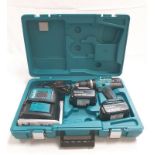 A Makita 18V Lithium-Ion Battery drill together with spare battery and charging station. In original