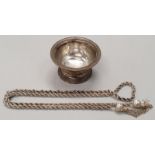 Silver sugar bowl together with a silver rope chain.