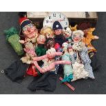 Suitcase containing vintage puppets of Punch and Judy and other relative characters.