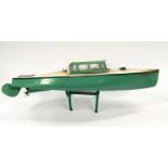 Hornby tinplate clockwork boat ?Venture? finished in green with stand.