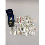 Collection of 29 Robertsons Gollys pin badges to include 9ct gold plated Farewell Golly badge, boxed