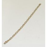 A 9ct gold diamond bracelet. (Ref WP)
