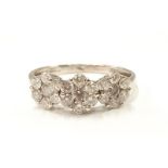 A 1 carat diamond trilogy cluster ring in 18ct white gold, size P. (Ref WP)