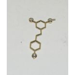 A 14ct gold diamond scientificate love symbol pendant. (Ref WP)