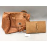 A tan leather handbag together with a tan clutch purse. (Ref WP)